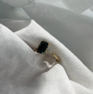 Radiant cut sapphire and diamond ring