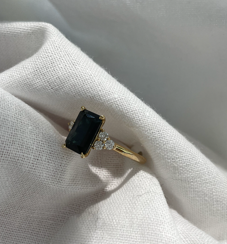 Radiant cut sapphire and diamond ring