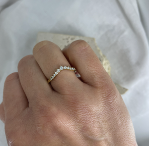 Curved claw set wedding and eternity style diamond band