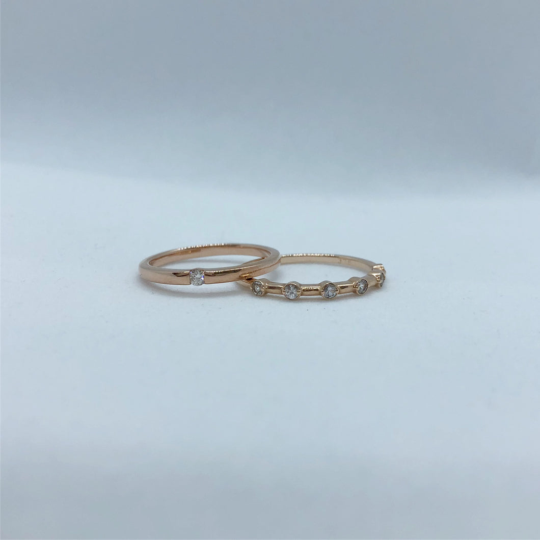 Dainty Design Rose Gold ring with suspended diamond